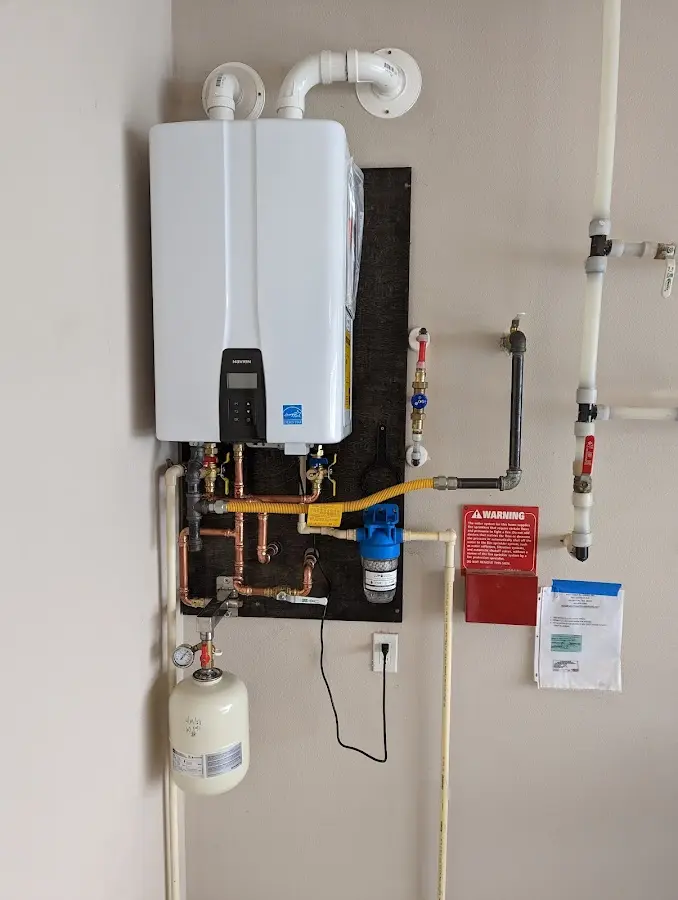 Professional plumber installing copper piping in a Palmer Ranch home